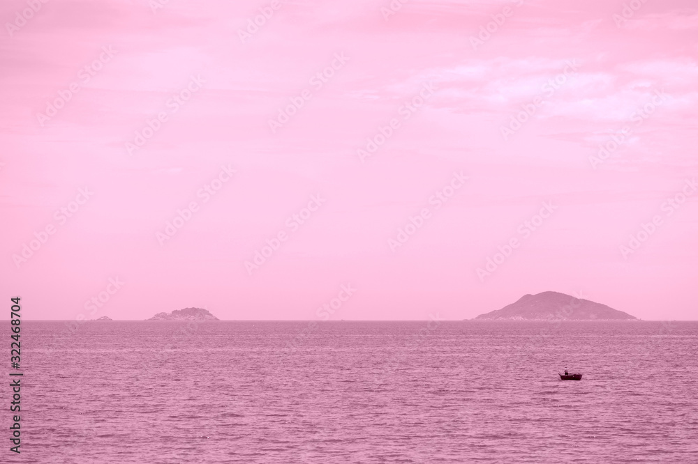 Morning seascape with islands and boats. Hoi An, Vietnam. Pink color toned Morning seascape with islands and boats. Hoi An, Vietnam. Pink color toned