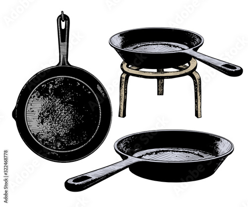 .Set of cast iron frying pans. Vector vintage illustration of kitchen utensils. Clipart.
