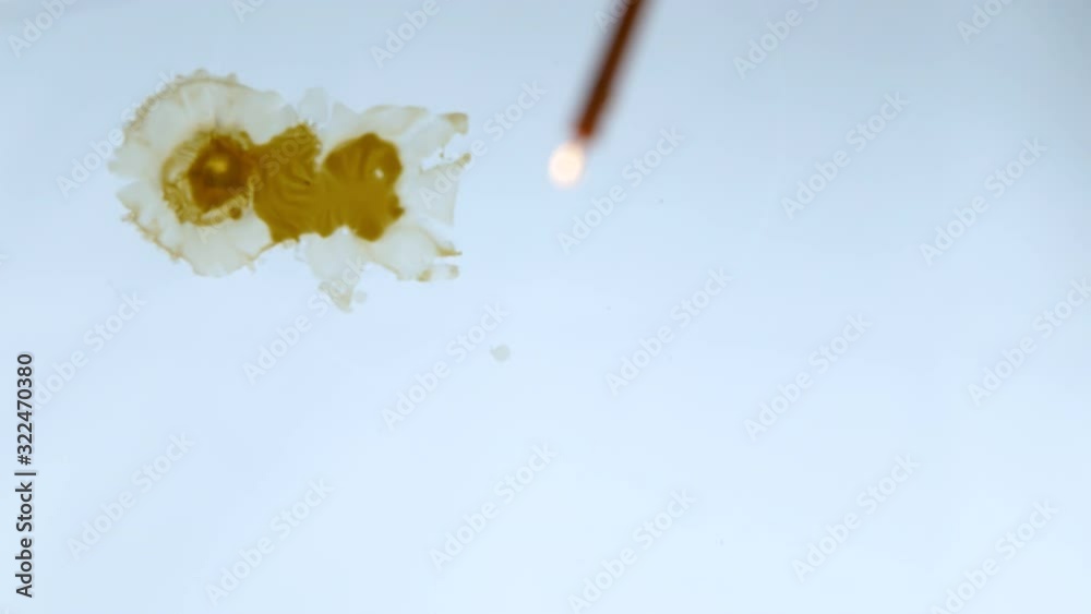 Candle drippings floating on the water surface Creative background