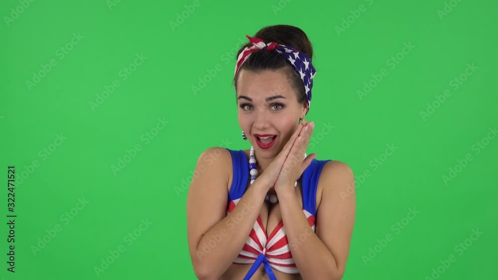 Portrait of beautiful girl in a swimsuit is surprised and rejoicing. Green screen Portrait of beautiful girl in a swimsuit is surprised and rejoicing. Green screen