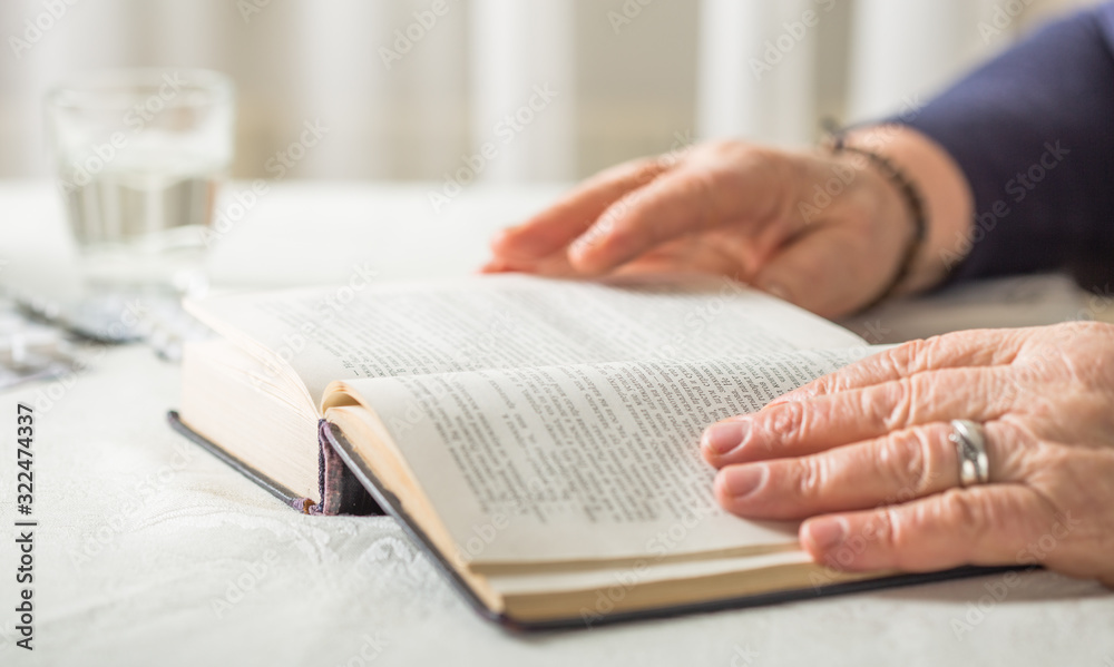 Elderly Caucasian Woman Reads A book. Pensioner Relaxation and brain education pleasure concept. Close Up. Elderly Caucasian Woman Reads A book. Pensioner Relaxation and brain education pleasure concept. Close Up.
