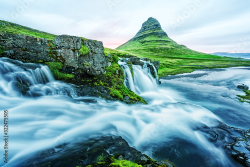 Incredible landscape with Kirkjufellsfoss waterfall and Kirkjufell mountain  Iceland  Europe.