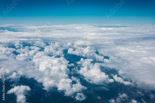 Fototapeta Naklejka Na Ścianę i Meble -  Sky with clouds from airplane window during flight.