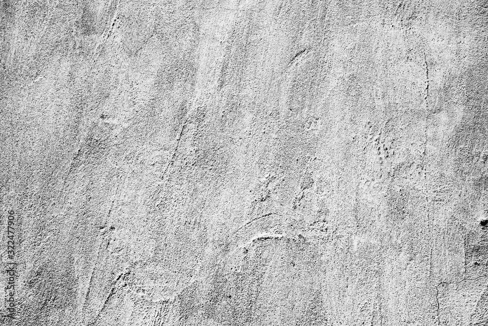 Naklejka premium Texture of a concrete wall with cracks and scratches which can be used as a background