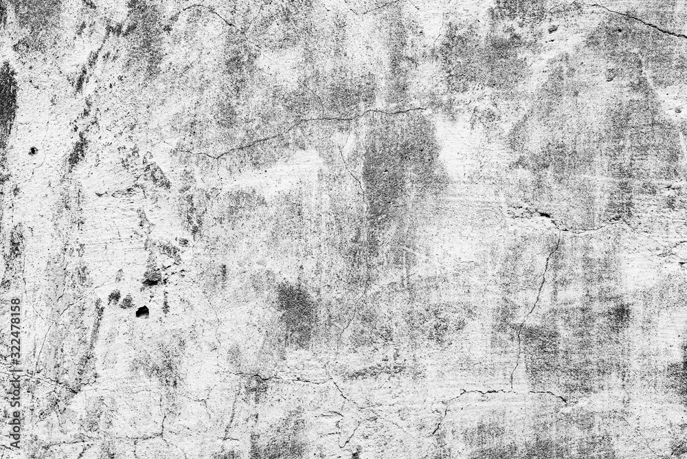 Texture of a concrete wall with cracks and scratches which can be used as a background