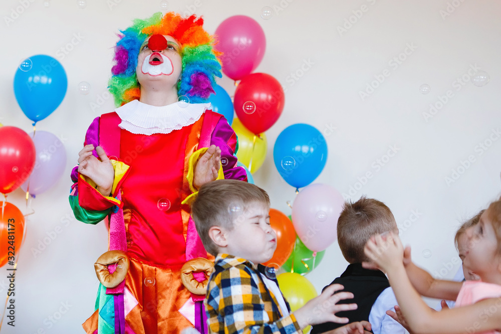 Children play with a clown Children play with a clown