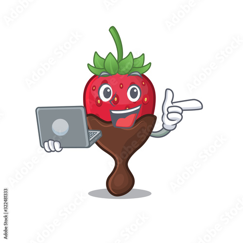Cool character of chocolate strawberry working with laptop