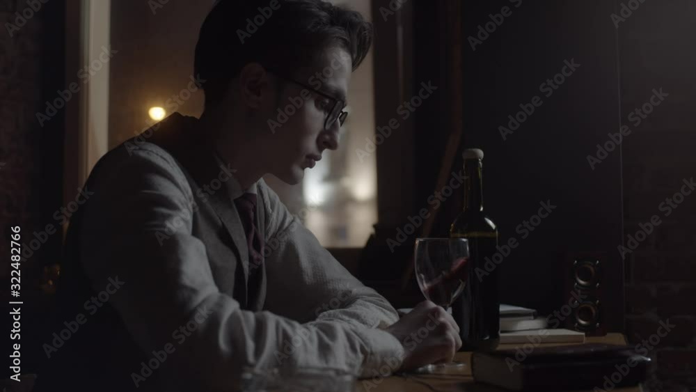 Young man with red wine, slow motion Young man with red wine, slow motion