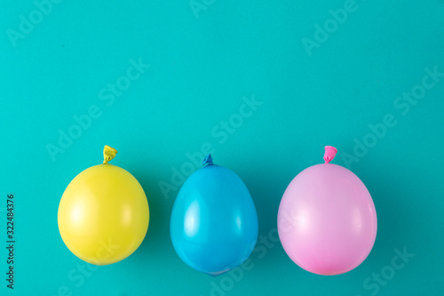 Three different balloons on a blue background