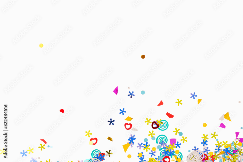 Colorful confetti on white background with copy space top view - obrazy, fototapety, plakaty 