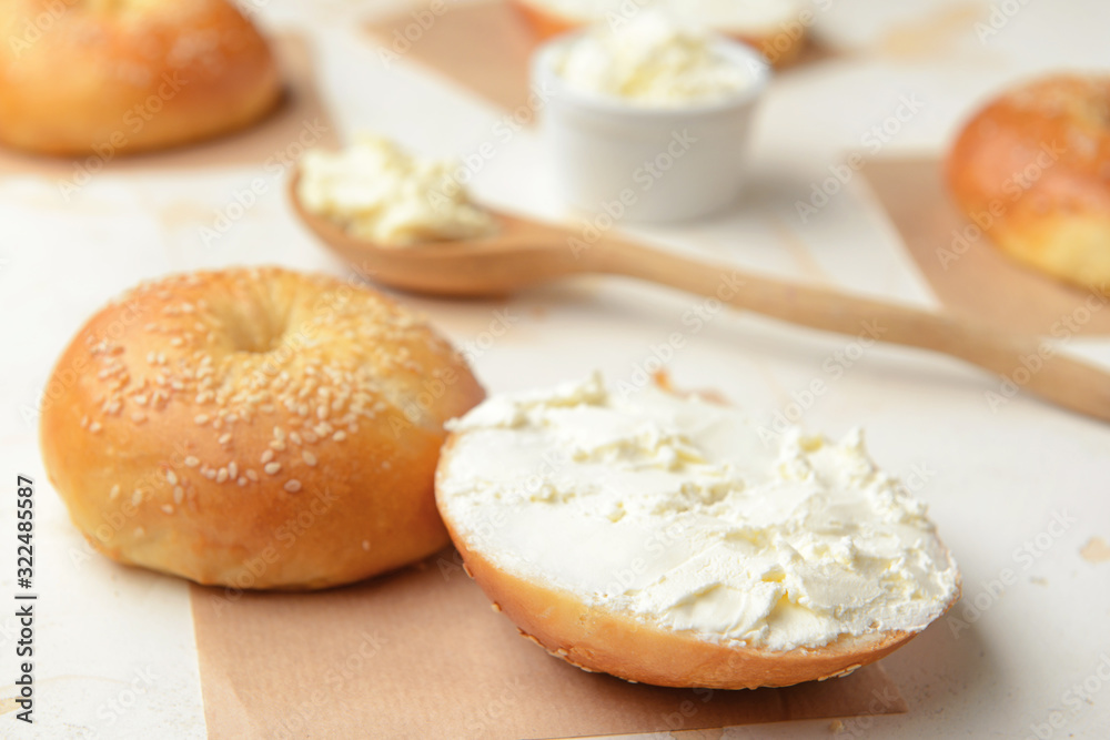 Fresh bun with tasty cream cheese on white background Fresh bun with tasty cream cheese on white background