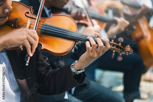 Canvas Print Symphony orchestra on white background, hands playing violin