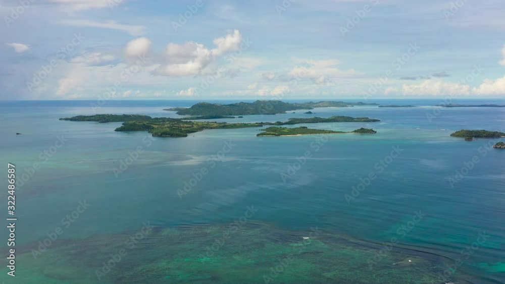 Seascape with islands and coral reefs, top view. Caramoan Islands, Philippines. Seascape with islands and coral reefs, top view. Caramoan Islands, Philippines.