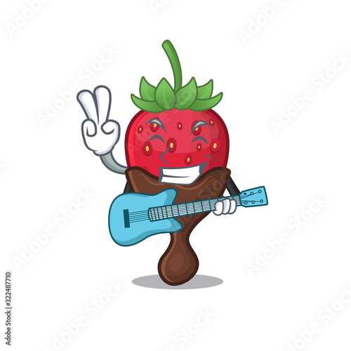 A picture of chocolate strawberry playing a guitar