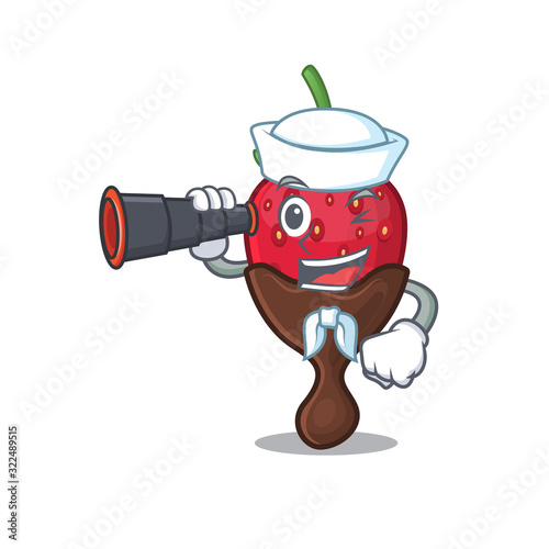 A picture of chocolate strawberry working as a Sailor with binocular