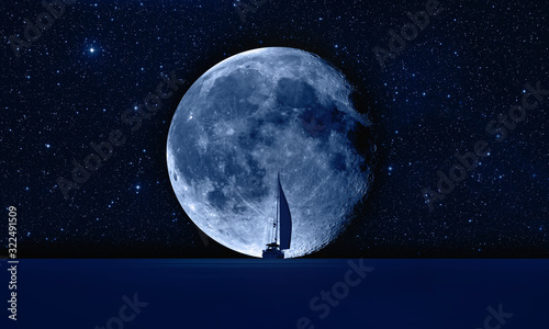 Fototapeta Naklejka Na Ścianę i Meble -  Lone yacht with super Blue Moon 