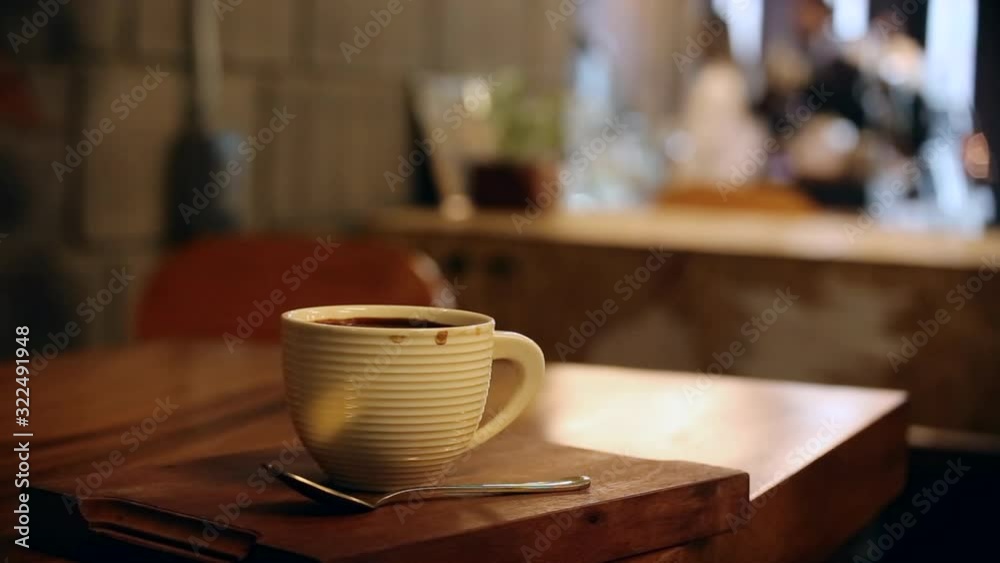 Coffee cup with cafe background Coffee cup with cafe background