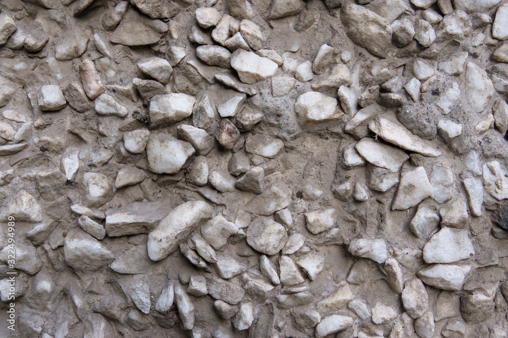 Rough surface with protruding white stones. Rough surface with protruding white stones.