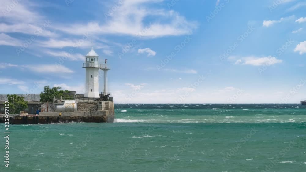 Cinemagraph of the sea landscape with a view of the white lighthouse. Yalta, Crimea Cinemagraph of the sea landscape with a view of the white lighthouse. Yalta, Crimea