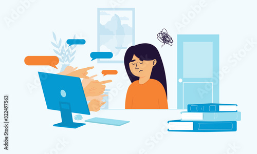 Upset girl sitting at the desk struggling because of cyberbullying. Hands pointing out of laptop screen on social media shaming victim. Stop victim blaming online. Sad woman reading haters comments.