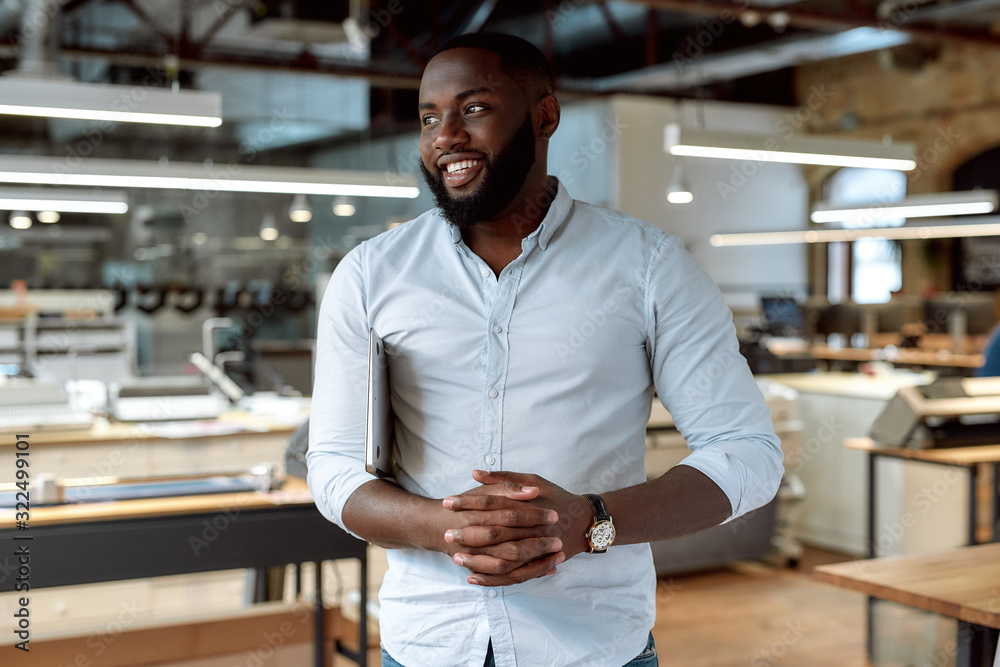 Be so hard-working that you forget to think about the negatives. Confident male worker posing in office Be so hard-working that you forget to think about the negatives. Confident male worker posing in office