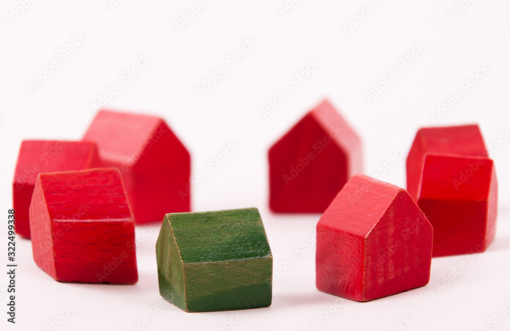 Small green wooden house different from other Small green wooden house different from other