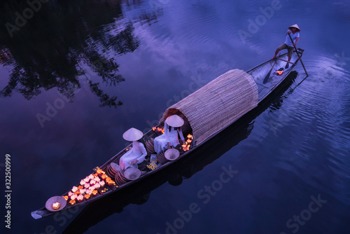 Hue, Vietnam - July 27, 2019 : Lighting candles on the river