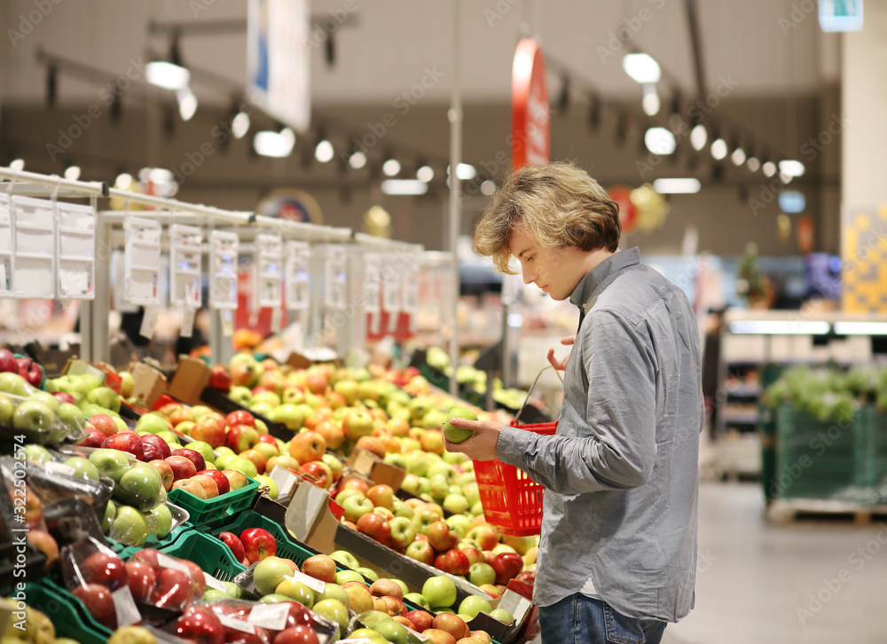 Man buying fruits at the market Man buying fruits at the market