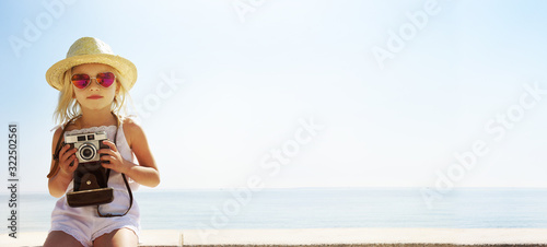 Little girl enjoying summer vacation at the sea © Guschenkova
