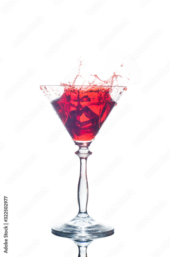 glass with red splash isolated on white glass with red splash isolated on white