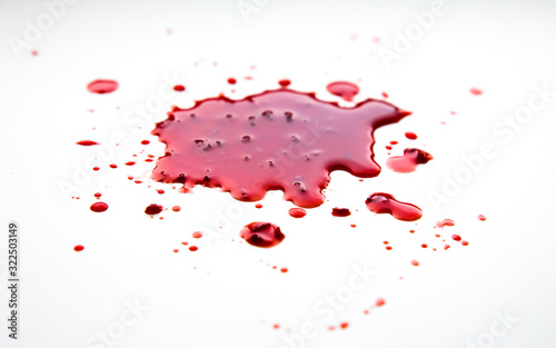 Red abstract spot. Blood stain with clots on white background. © Vadym