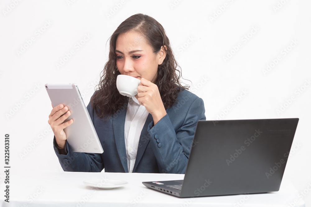 Beautiful young executive with her work and coffee Beautiful young executive with her work and coffee