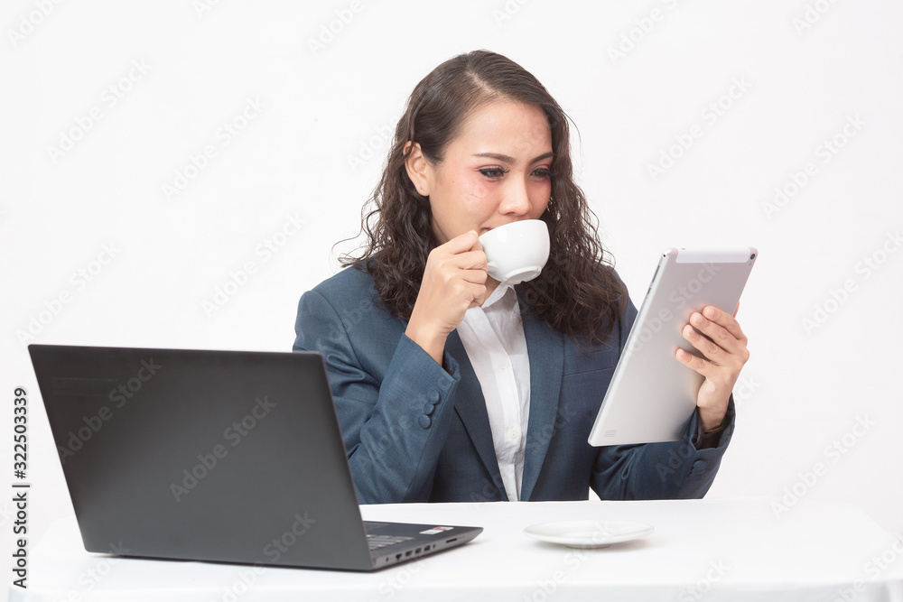 Beautiful young executive with her work and coffee Beautiful young executive with her work and coffee