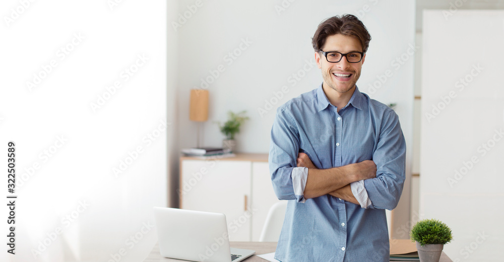 Confident Freelancer Guy Crossing Hands Standing In Home Office, Panorama