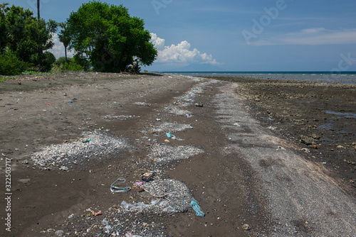 Beach with a large amount of plastic trash on it. Pemuteran beach, Bali, 01/13/19 photo