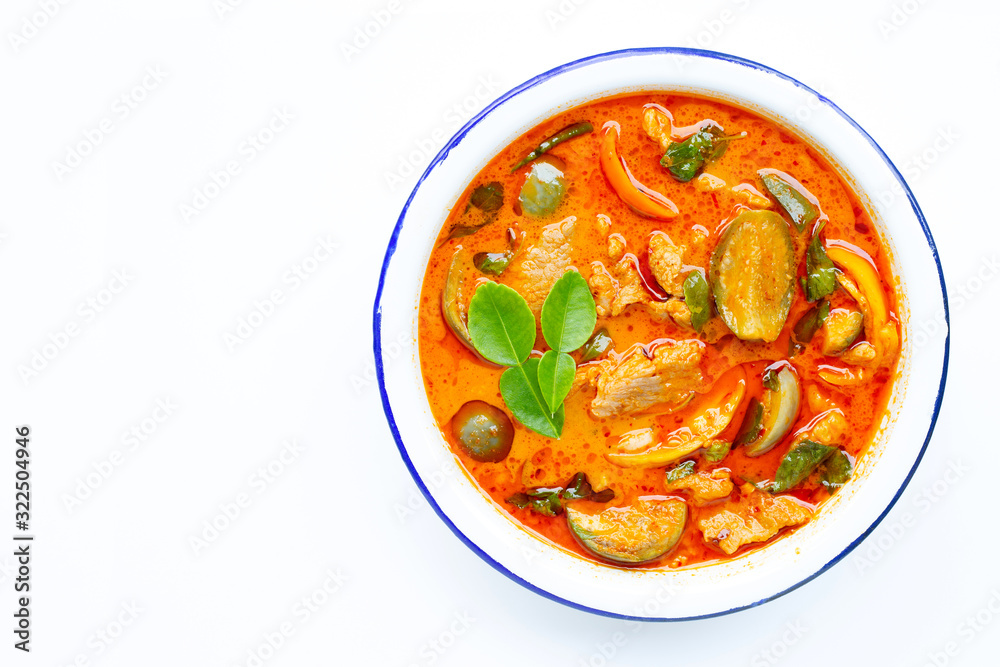 Red curry round eggplant with pork, white background. Copy space