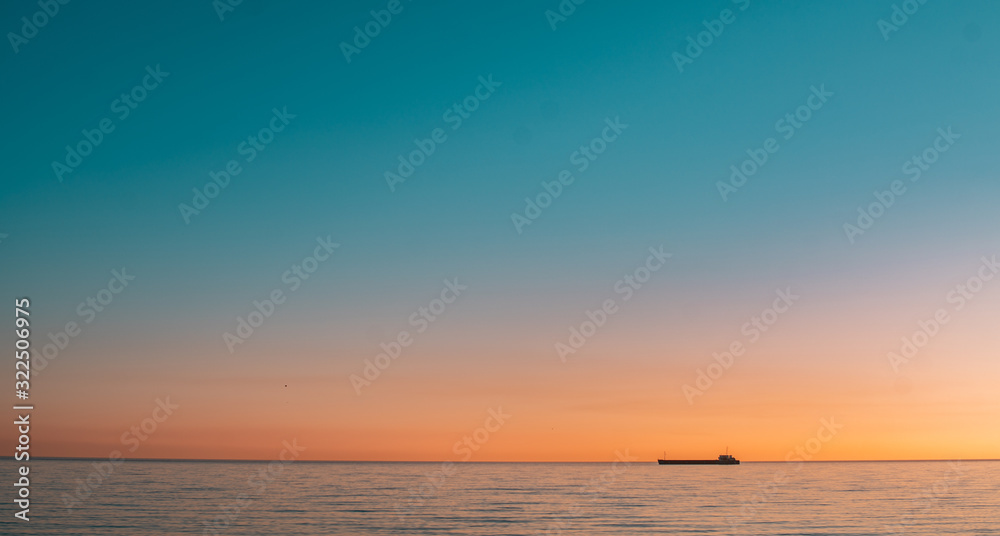 Sea horizon line and sunset photo.