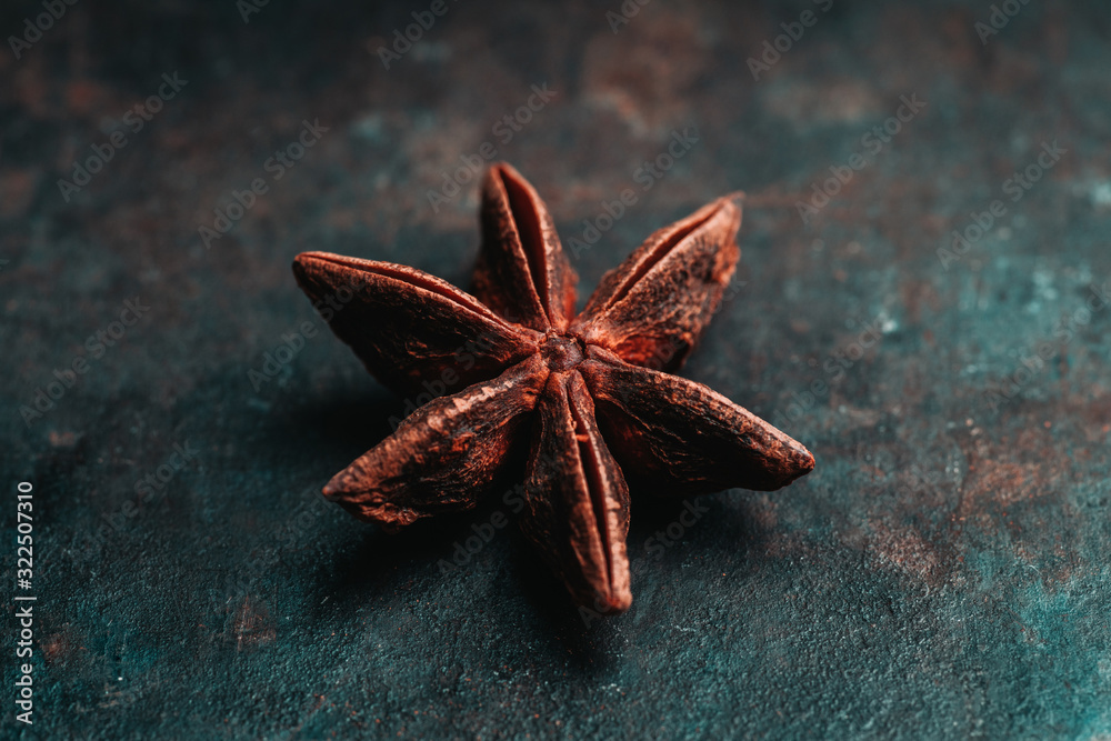 Dried anise stars on the rustic background. Selective focus. Shallow depth of field. Dried anise stars on the rustic background. Selective focus. Shallow depth of field.