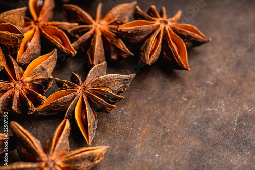 Dried anise stars on the rustic background. Selective focus. Shallow depth of field.