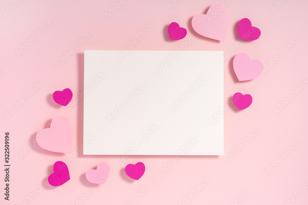 Valentine hearts with shadow, blank sheet of paper, template for design on pink surface Valentine hearts with shadow, blank sheet of paper, template for design on pink surface