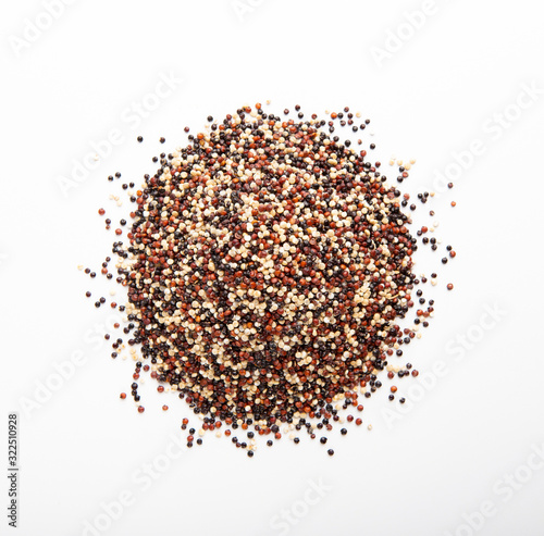 Mixture of red, black and white quinoa seeds isolated