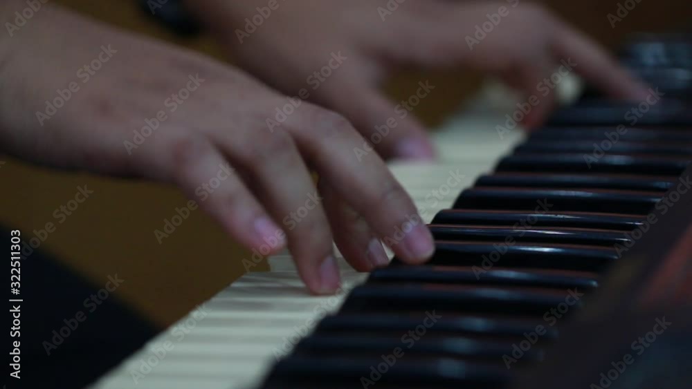 Hands Asian man pianist plays gentle classical music on grand piano keys, Close up hand playing piano or training classical music. Professional harmony on keyboard player in concert, 4k Hands Asian man pianist plays gentle classical music on grand piano keys, Close up hand playing piano or training classical music. Professional harmony on keyboard player in concert, 4k