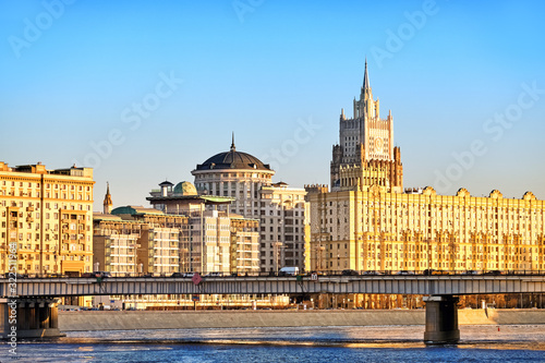 Schilderij op canvas Classic moscow city russia architecture landmark old stalin empire style building on river embankment with british embassy ministry of foreign affairs against sunset sky background