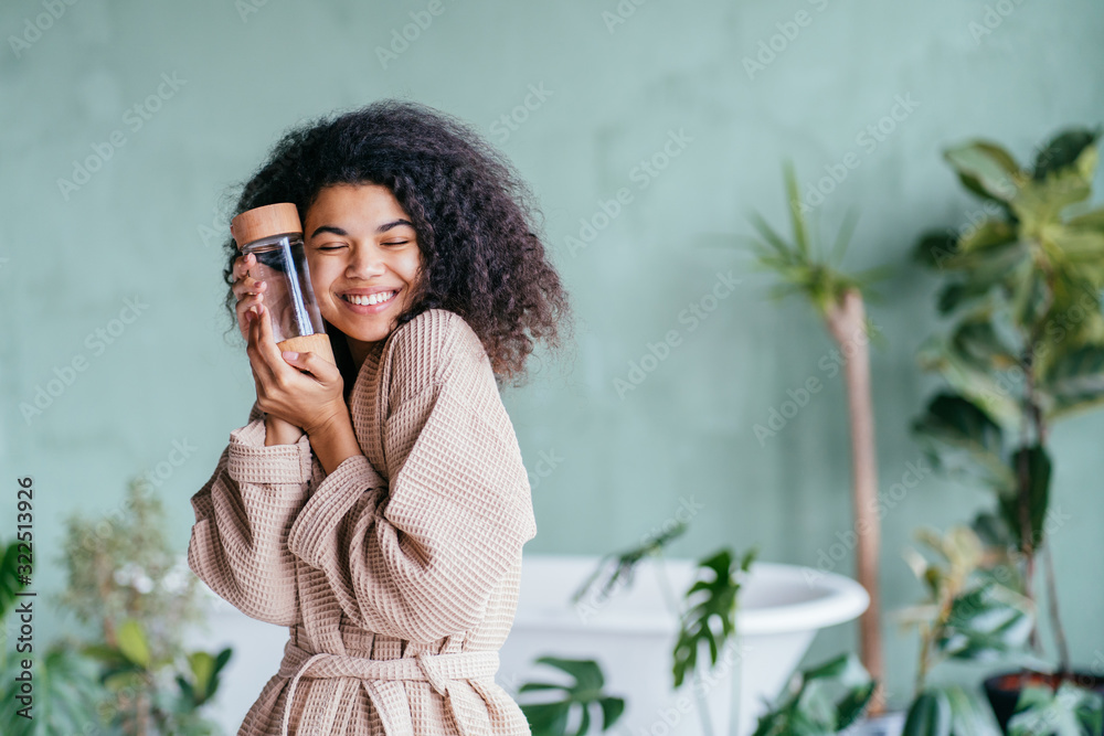 Reusable drink bottle in woman hands. Save our planet. Zero waste concept. Green and conscious lifestyle concept. Reusable drink bottle in woman hands. Save our planet. Zero waste concept. Green and conscious lifestyle concept.