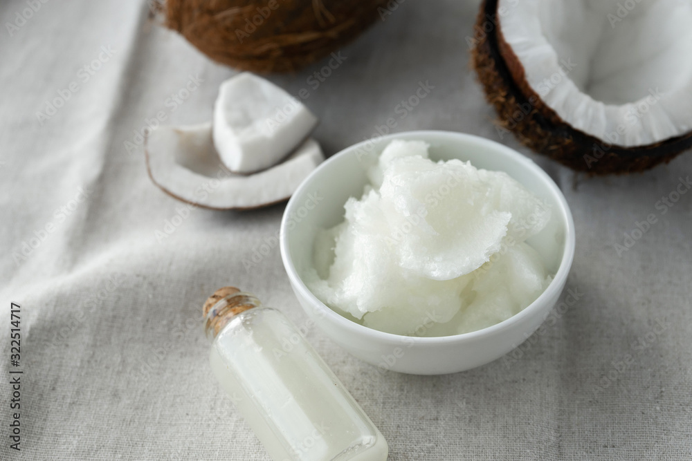 image of coconut oil and fresh coconuts . image of coconut oil and fresh coconuts .