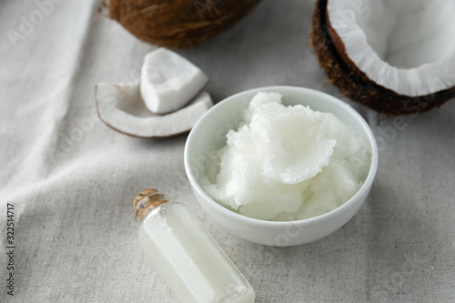 image of coconut oil and fresh coconuts .