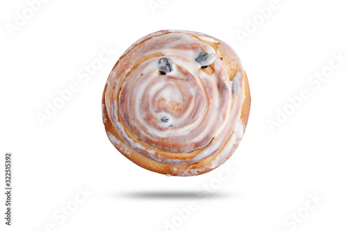  bun with raisins in white glaze. isolated on white background