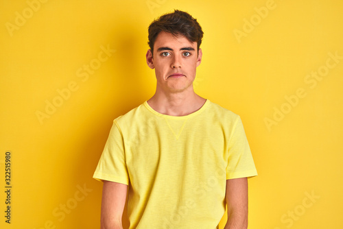 Wallpaper Mural Teenager boy wearing yellow t-shirt over isolated background depressed and worry for distress, crying angry and afraid. Sad expression. Torontodigital.ca
