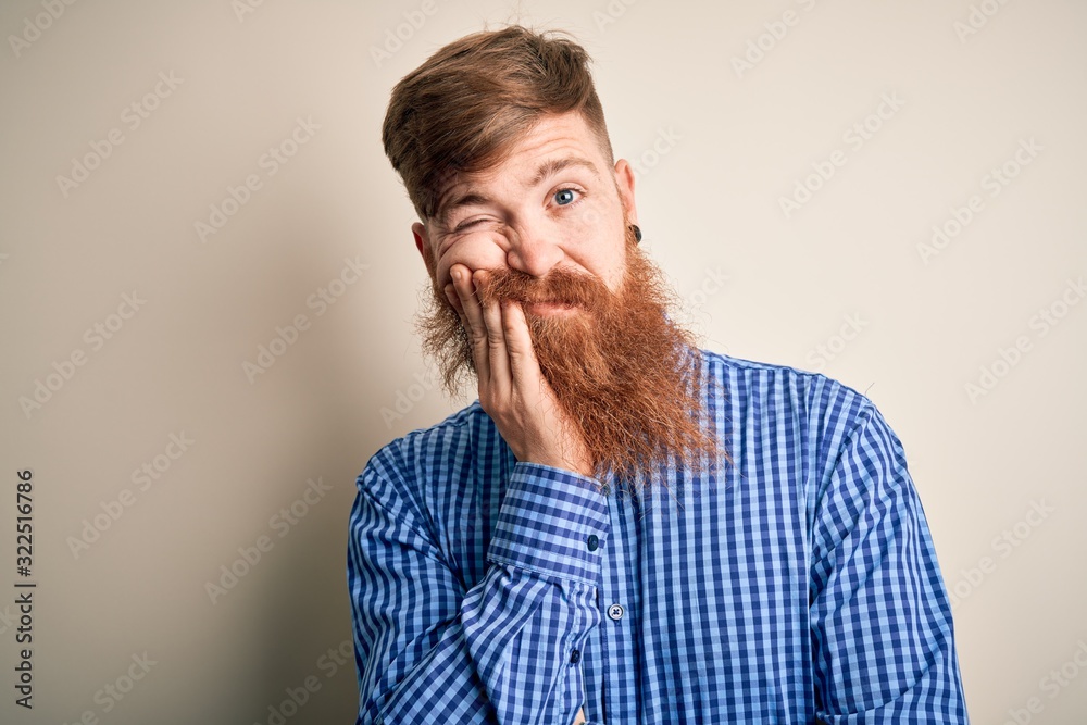 Handsome Irish redhead business man with beard standing over isolated background thinking looking tired and bored with depression problems with crossed arms. Handsome Irish redhead business man with beard standing over isolated background thinking looking tired and bored with depression problems with crossed arms.