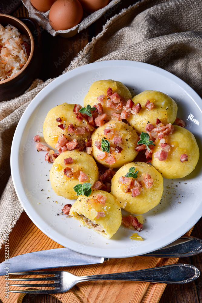 Polish dumplings with meat and mushroom sauerkraut filling